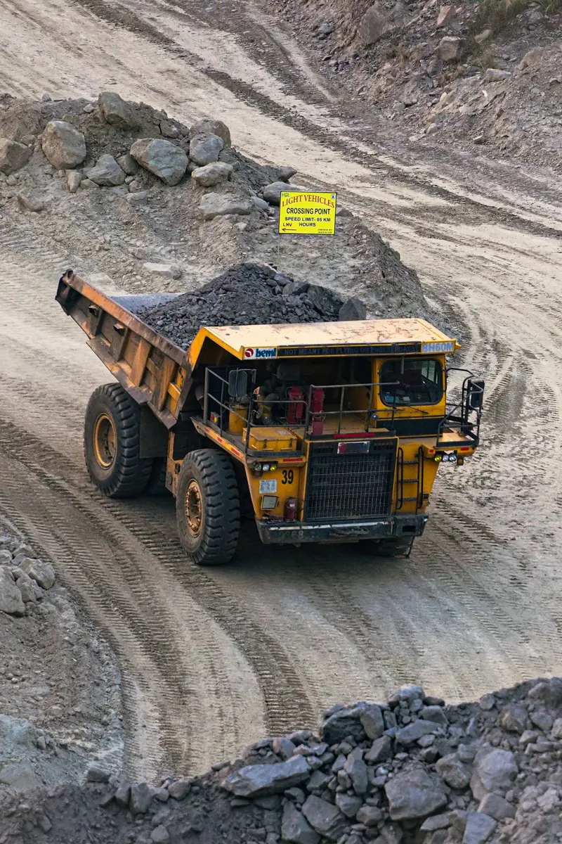 A haul truck climbing a mine road